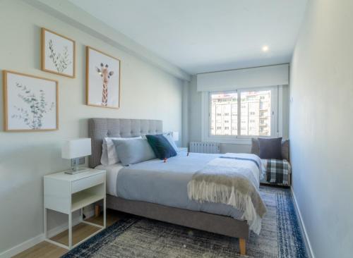 A bed or beds in a room at Moderno, Castro, Corazón de Vigo