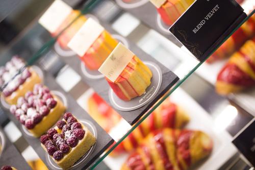 two shelves of different types of desserts on display at JW Marriott Quito in Quito