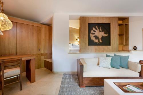 a living room with a couch and a table at The Westin Reserva Conchal, an All-Inclusive Golf Resort & Spa in Playa Conchal