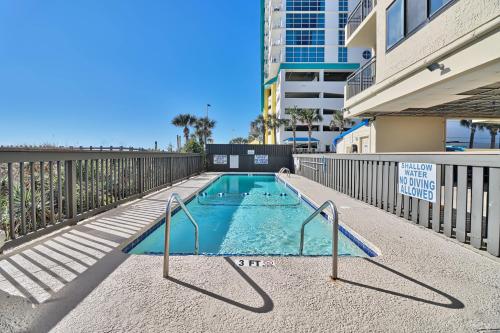 a small swimming pool in the middle of a building at Direct Ocean Front 3BR/2BA Dog Friendly in Myrtle Beach