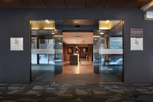 a glass door in a building with a room at Hotel AC Baqueira Ski Resort, Autograph Collection in Baqueira-Beret