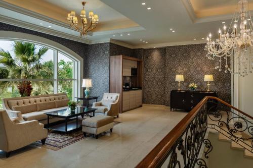 a living room with a couch and a table at The St. Regis New Capital Cairo in Cairo