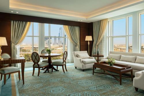 a living room with a couch and a table at The St. Regis New Capital Cairo in Cairo
