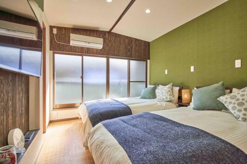 En eller flere senge i et værelse på 58㎡, Max8》5mins to USJ!Good access to downtown!