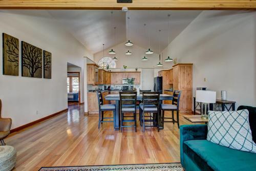 a living room and dining room with a table and chairs at Twin Pines Cabin in Wilderness Ranch on Hwy 21, AMAZING Views, 20 ft ceilings, fully fenced yard, pet friendly, , Go paddle boarding at Lucky Peak, or snowshoeing in Idaho City and take in the hot springs, sleeps 10! in Boise