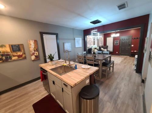 a kitchen and living room with a table and a dining room at King Bed In Main Floor - Downtown Vacation Rental in Kalamazoo