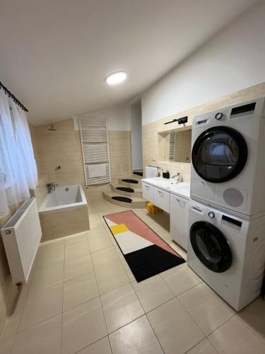 a laundry room with a washer and dryer in it at Na Kovárně in Bernartice
