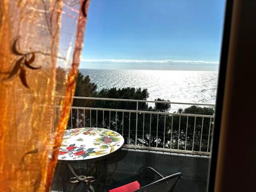 a view of the ocean from a balcony at Suite Fronte Mare - Sanremo in Sanremo