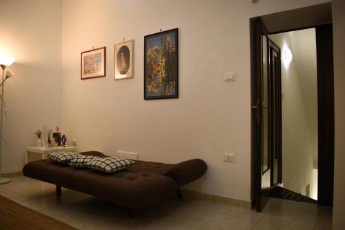 a room with a bed with a pillow on it at La Terrazza sul Tempio in Brindisi