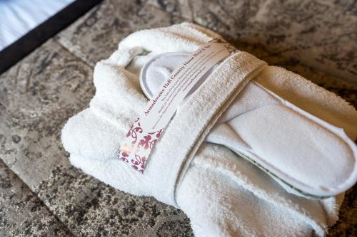 a pair of white slippers sitting on the ground at Armathwaite Hall Hotel & Spa in Bassenthwaite