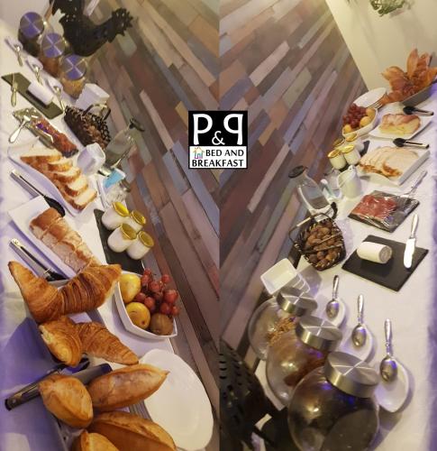 a table of food with bread and desserts on it at Bed and Breakfast P&P Nîmes-Centre in Nîmes