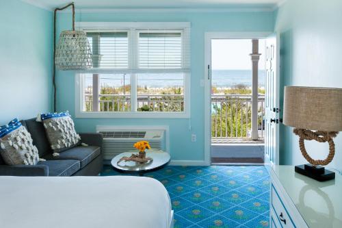 a living room with a couch and a view of the ocean at Beach Shack in Cape May