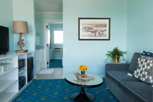 a living room with a couch and a table at Beach Shack in Cape May