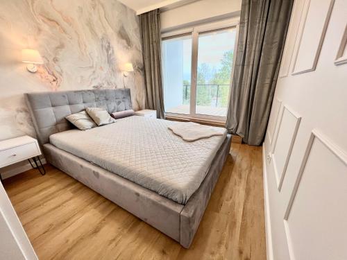 Säng eller sängar i ett rum på Apartament Superior & SPA Marina Dziwnów