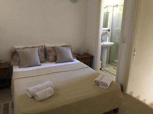 Ένα ή περισσότερα κρεβάτια σε δωμάτιο στο Natica Mare Villas