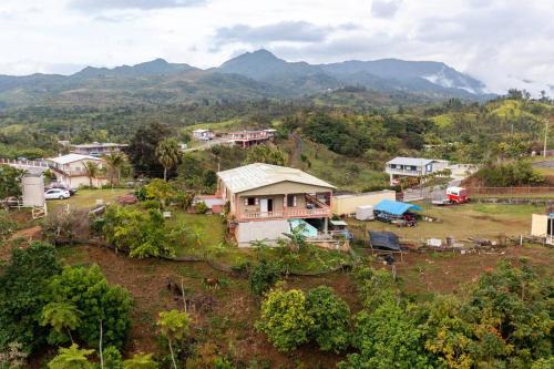 an aerial view of a small village with mountains in the background at Cabin mountain view near Ponce slepts 8 in Ponce
