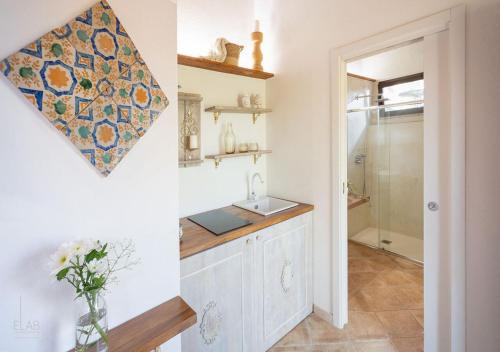 a bathroom with a sink and a shower at B&B Villa Vittoria in Giardini Naxos