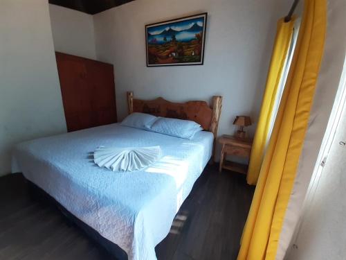 Ένα ή περισσότερα κρεβάτια σε δωμάτιο στο Hotel del Bosque