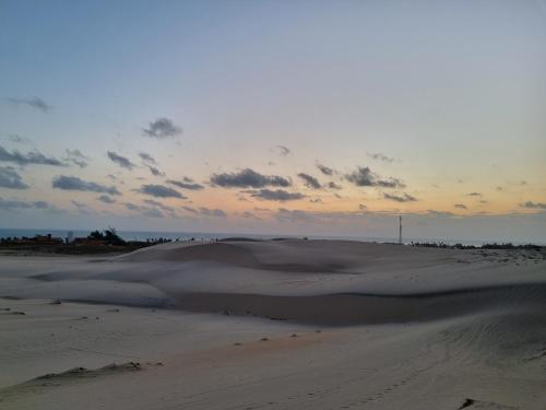 a sand dune in the middle of a desert at Casa Ferreira Cumbuco in Caucaia