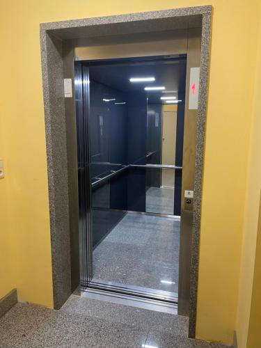 a hallway with a glass door in a building at Hotel Rheinfels in Sankt Goar