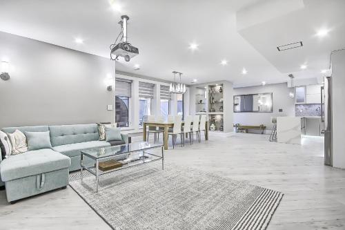 a living room with a couch and a table at Charming and Luxurious 2BR+1Bath Guest Suite in Toronto