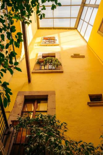 an overhead view of a building with tables and plants at Hotel Casa Santa Lucia in Zacatecas