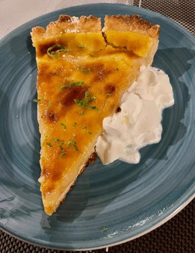 a piece of pie on a blue plate at El Caribeo in Bocas Town