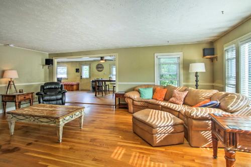 a living room with a couch and a table at Walk to Beach Maine Home with Hot Tub and Deck! in Old Orchard Beach