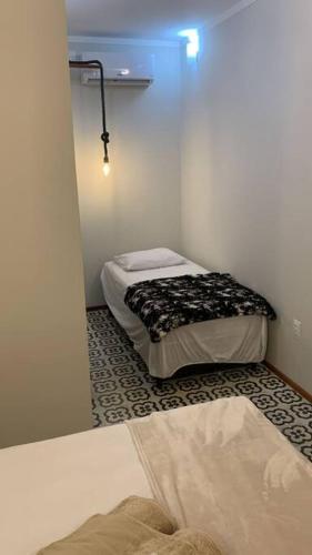 Ένα ή περισσότερα κρεβάτια σε δωμάτιο στο Casarão 47