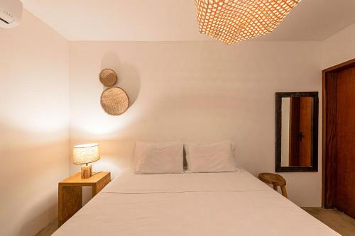 Ένα ή περισσότερα κρεβάτια σε δωμάτιο στο Hostel Noronha 350