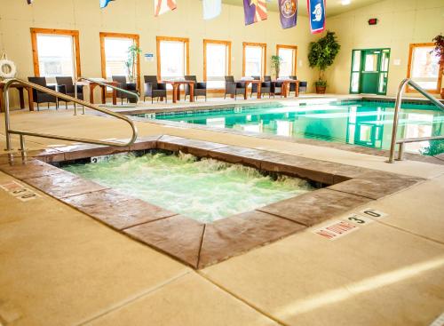 a pool in a building with a swimming pool at Flying Saddle Resort and Steak House in Alpine