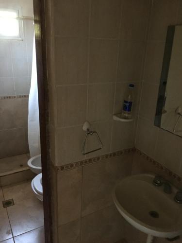 een badkamer met een wastafel en een toilet bij Villa Pehuenia in Villa Pehuenia