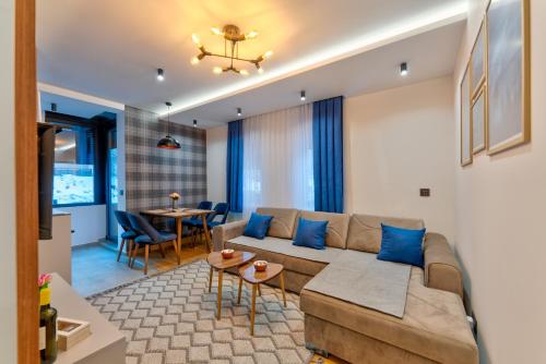 a living room with a couch and a table at Silver sky 11 in Zlatibor