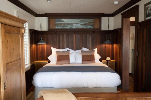a bedroom with a large bed in a boat at Nick's Cove in Marshall