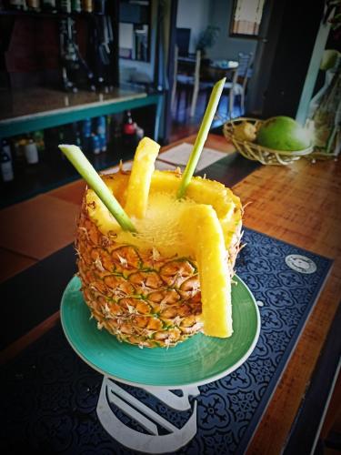 a pineapple cake on a plate on a table at El Caribeo in Bocas Town