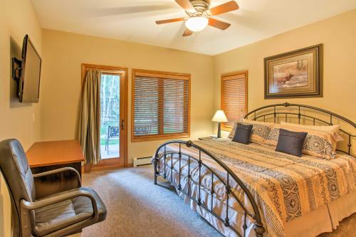 a bedroom with a bed and a desk and a chair at Steamboat Springs Townhome 1 Block to Ski Lifts! in Steamboat Springs