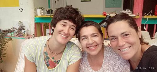 a group of three people posing for a picture at HOSTAL CASA VICTORIA PIJAO in Pijao