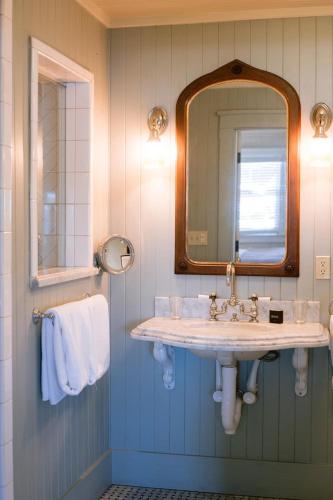 a bathroom with a sink and a mirror at Nick's Cove in Marshall