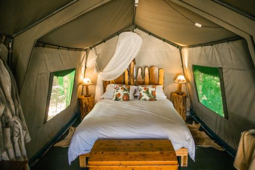 a bedroom with a bed in a tent at HighlandsView in Swellendam