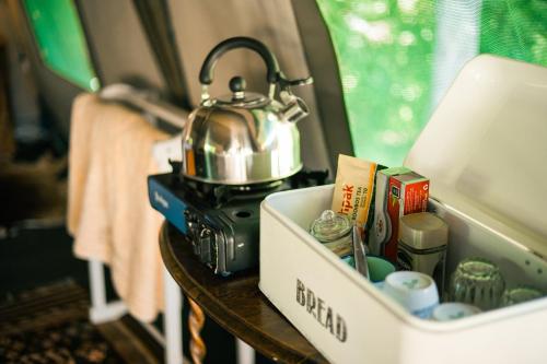 a table with a tea kettle on top of it at HighlandsView in Swellendam
