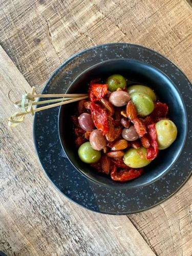 a blue bowl of food on a table with chopsticks at Woodcote Hotel in Hooton
