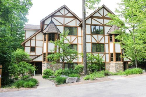 an exterior view of a house with trees at The Highlands at Harbor Springs in Harbor Springs