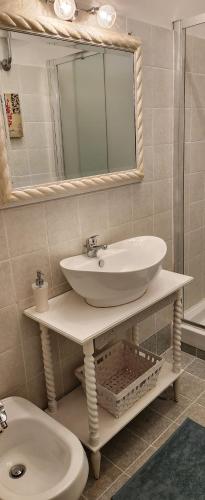 a bathroom with a sink and a toilet at Chic 'N Charme Trastevere Terrace in Rome