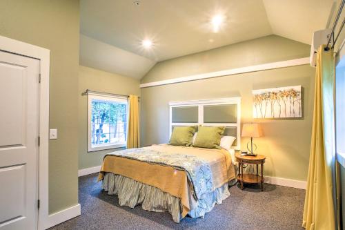 a bedroom with a bed and a window at Welcoming Downtown Branson Cottage with Pool Access! in Branson