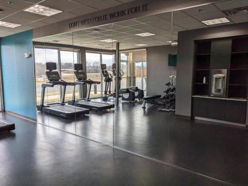 a gym with treadmills and chairs in a building at Fairfield Inn & Suites by Marriott Poplar Bluff in Poplar Bluff
