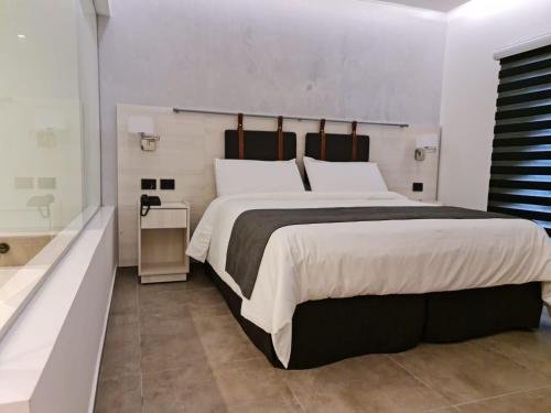 Postel nebo postele na pokoji v ubytování Mar Azul Suites Apart Boutique