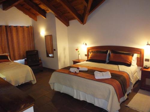 Ένα ή περισσότερα κρεβάτια σε δωμάτιο στο Hotel Pucon Green Park