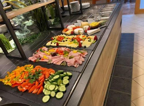 a buffet line with many different types of vegetables at Landhotel Mariensäule in Wernstein am Inn