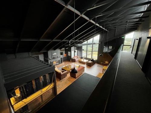 an overhead view of a living room with a fireplace at Thousand Lakes Lodge in Liawenee