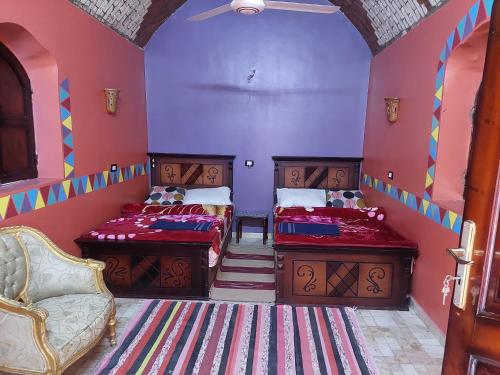 En eller flere senge i et værelse på Mostafa guesthouse